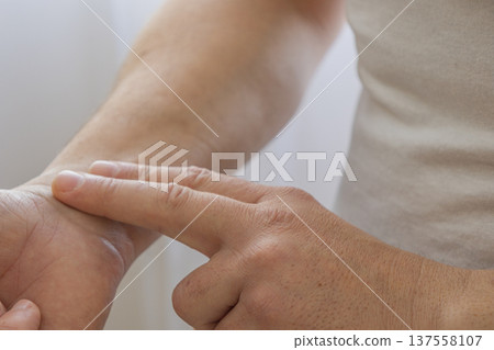 Checking Pulse On Wrist With Fingers 137558107