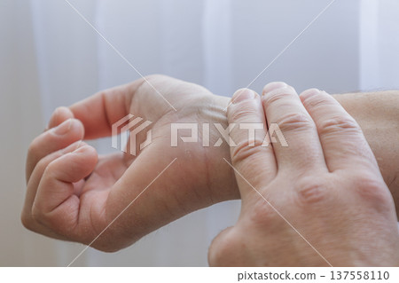 Checking Pulse On Wrist With Fingers 137558110