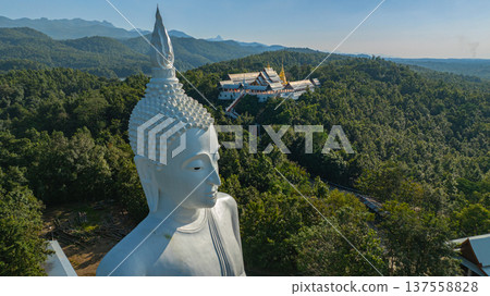 Aerial view of Wat Phra That Pu Jae Ancient Mountain Temple in Phrae Aerial view of Wat Phra That Pu Jae Ancient Mountain Temple in Phrae 137558828