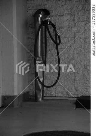 Water supply equipment with hose installed along the wall Water supply equipment with hose installed along the wall 137559038