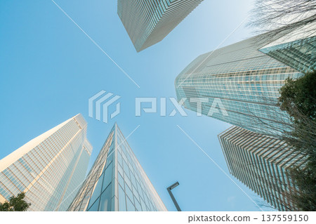 Redevelopment area in Minato Ward, Tokyo: Skyscrapers and office buildings towering into the blue sky 137559150