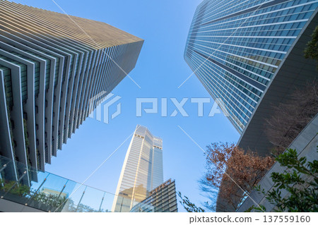 Redevelopment area in Minato Ward, Tokyo: Skyscrapers and office buildings towering into the blue sky 137559160