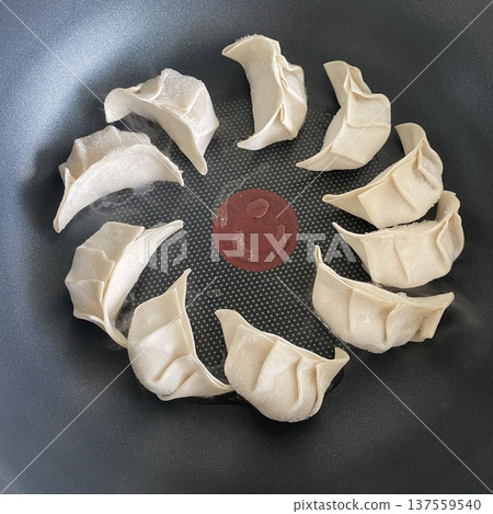 Korean dumplings filled with a mix of savory ingredients like ground meat, tofu, and vegetables. Mandu can be steamed, boiled, or pan-fried, making it a versatile and delicious snack or meal. Korean dumplings filled with a mix of savory ingredients like ground meat, tofu, and vegetables. Mandu can be steamed, boiled, or pan-fried, making it a versatile and delicious snack or meal. 137559540
