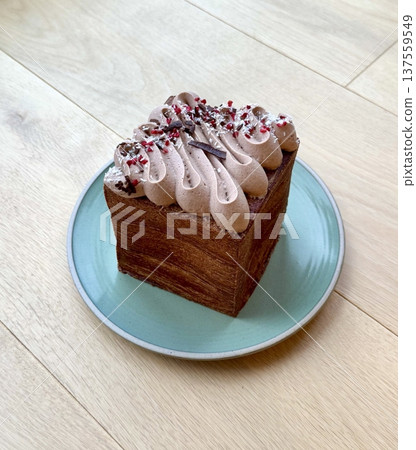 Cube croissant with unique square shape and golden flaky layers, combining a crisp buttery exterior with soft airy interior, creating a modern twist on the classic pastry Cube croissant with unique square shape and golden flaky layers, combining a crisp buttery exterior with soft airy interior, creating a modern twist on the classic pastry 137559549