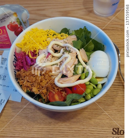 A vibrant poke bowl filled with fresh diced fish, vegetables, and flavorful toppings. Perfect for food photography, this dish embodies the essence of healthy, colorful eating and Hawaiian-inspired. A vibrant poke bowl filled with fresh diced fish, vegetables, and flavorful toppings. Perfect for food photography, this dish embodies the essence of healthy, colorful eating and Hawaiian-inspired. 137559568