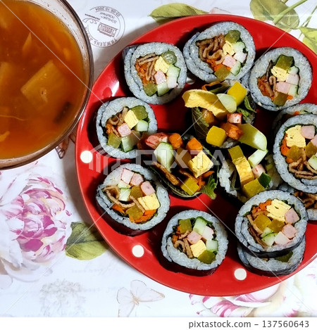 Delicious kimbap rolls filled with fresh vegetables, seasoned rice, and savory proteins, all wrapped in crisp seaweed. A perfect combination of flavor and texture in every bite. Delicious kimbap rolls filled with fresh vegetables, seasoned rice, and savory proteins, all wrapped in crisp seaweed. A perfect combination of flavor and texture in every bite. 137560643