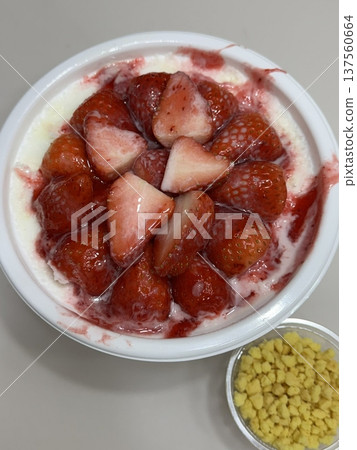 Soft and fluffy strawberry bingsu with finely shaved ice, sweet strawberry syrup, and fresh strawberry slices. A refreshing and delightful Korean dessert, perfect for a cool and fruity treat. Soft and fluffy strawberry bingsu with finely shaved ice, sweet strawberry syrup, and fresh strawberry slices. A refreshing and delightful Korean dessert, perfect for a cool and fruity treat. 137560664