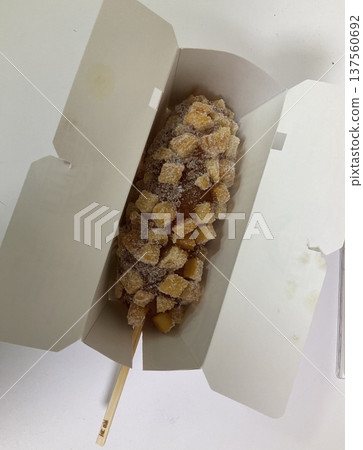 Korean corn dog, a crispy snack coated in a sweet batter, often stuffed with sausage, cheese, or both. Topped with sugar, ketchup, or mustard for a delightful mix of flavors and textures. Korean corn dog, a crispy snack coated in a sweet batter, often stuffed with sausage, cheese, or both. Topped with sugar, ketchup, or mustard for a delightful mix of flavors and textures. 137560692