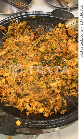 Bokkeumbap, a Korean fried rice dish, often made with kimchi or other vegetables, meats, and seasoned with savory spices. A comforting and flavorful meal! 137560710