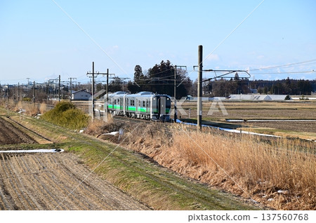Tohoku Main Line in the morning. New HB-E220 series diesel car. Tohoku Main Line in the morning. New HB-E220 series diesel car. 137560768