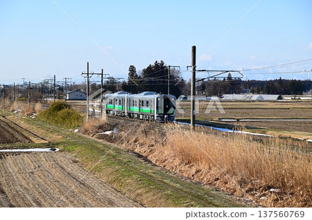 Tohoku Main Line in the morning. New HB-E220 series diesel car. Tohoku Main Line in the morning. New HB-E220 series diesel car. 137560769