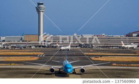 Front of Haneda Airport's control tower and Korean Air passenger plane Front of Haneda Airport's control tower and Korean Air passenger plane 137560960