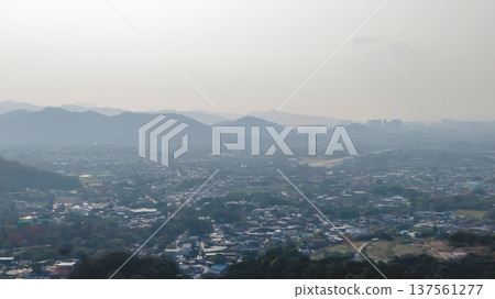 Pat Heung rural valley stretching beneath distant hazy mountains March 7 2026 137561277