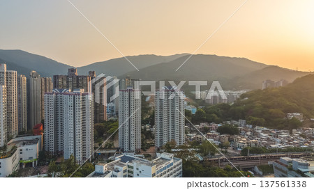 Tai Po residential skyline glowing under warm sunset light March 7 2026 Tai Po residential skyline glowing under warm sunset light March 7 2026 137561338