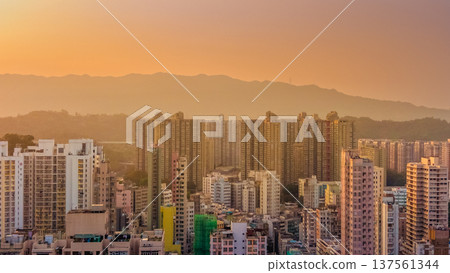 Tai Po residential skyline glowing under warm sunset light March 7 2026 Tai Po residential skyline glowing under warm sunset light March 7 2026 137561344