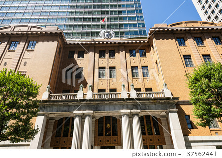 Low-angle view of the Mitsubishi UFJ Trust and Banking Museum, situated in the Marunouchi business and financial district, Chiyoda, Tokyo, Japan. Low-angle view of the Mitsubishi UFJ Trust and Banking Museum, situated in the Marunouchi business and financial district, Chiyoda, Tokyo, Japan. 137562441