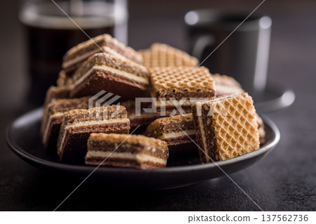 Stack of Chocolate Wafer Cookies on Plate with Coffee Cup and French Press Stack of Chocolate Wafer Cookies on Plate with Coffee Cup and French Press 137562736