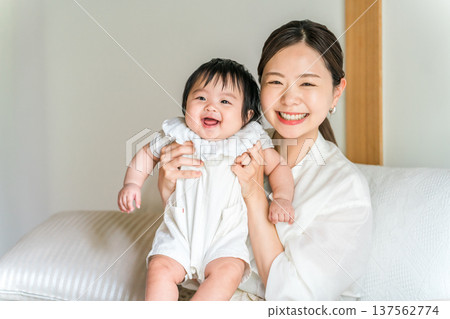 Mother holding a baby, mom (childcare, full-time housewife) 137562774