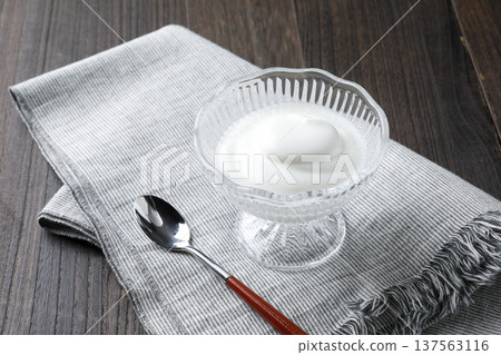 Plain yogurt in a glass bowl 137563116