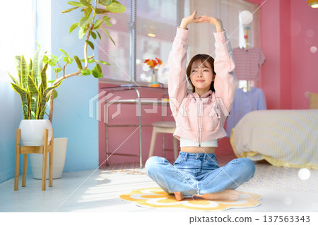 A woman stretching in her room: Happy Pop A woman stretching in her room: Happy Pop 137563343