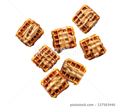 Golden brown square waffles drizzled with caramel sauce, in flat lay style isolated on white background, concept of sweet food 137563440