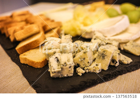 Cheese platter with blue cheese and bread on slate board 137563518