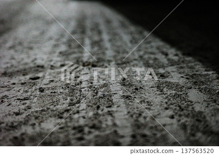 Car tire track in wet mud close-up texture 137563520