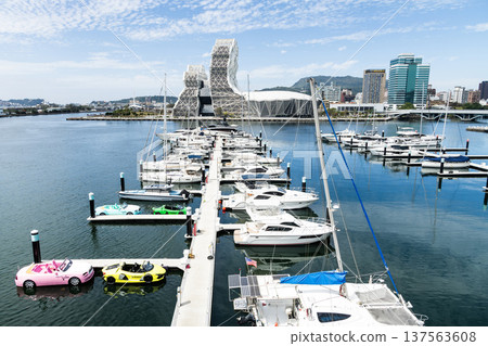 View of Argo Yacht Marina at Glory Pier of Kaohsiung Port, Taiwan, and the Kaohsiung Music Center building. 137563608