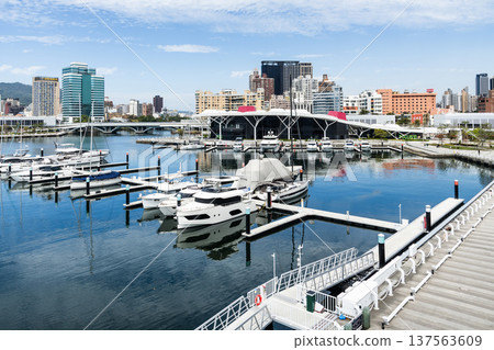 View of Argo Yacht Marina at Glory Pier of Kaohsiung Port, Taiwan. with the Coral Zone building of Kaohsiung Music Center. View of Argo Yacht Marina at Glory Pier of Kaohsiung Port, Taiwan. with the Coral Zone building of Kaohsiung Music Center. 137563609