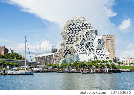 Close-up of Kaohsiung Music Center in Port of Kaohsiung, Taiwan. The white hexagonal building structure on the shore of Love Pier. Close-up of Kaohsiung Music Center in Port of Kaohsiung, Taiwan. The white hexagonal building structure on the shore of Love Pier. 137563620