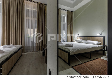 Double Bed in Minimalist Hotel Room with Mirror Reflection Double Bed in Minimalist Hotel Room with Mirror Reflection 137563664
