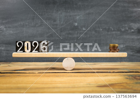 2026 Balance Concept With Coins On Wooden Seesaw Financial Planning 137563694