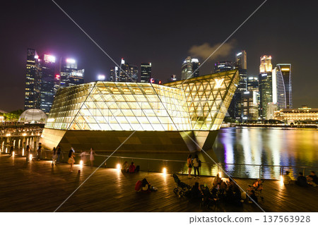 The world's only floating Louis Vuitton boutique is located in a spectacular Crystal Pavilion on the waters of Marina Bay Sands.  137563928