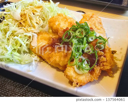 Chicken tempura with green onions and sauce 137564061