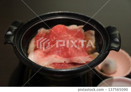Nov 25 2025 Delicious Thin Beef Slices Simmering in a Traditional Hot Pot Nov 25 2025 Delicious Thin Beef Slices Simmering in a Traditional Hot Pot 137565090