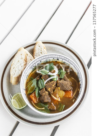 Bo Kho traditional vietnamese beef and vegetable stew on white table in da nang vietnam restaurant Bo Kho traditional vietnamese beef and vegetable stew on white table in da nang vietnam restaurant 137565277