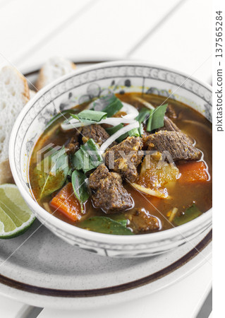 Bo Kho traditional vietnamese beef and vegetable stew on white table in da nang vietnam restaurant Bo Kho traditional vietnamese beef and vegetable stew on white table in da nang vietnam restaurant 137565284