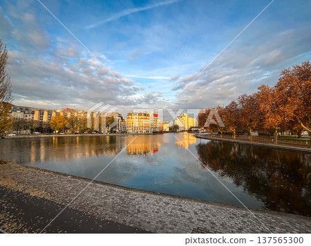 Wide sunset view of Ourcq canal in Paris France Wide sunset view of Ourcq canal in Paris France 137565300