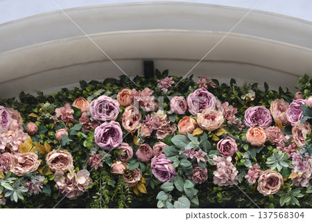 Floral arrangement under a classic architectural arch Floral arrangement under a classic architectural arch 137568304