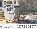 Metal trash can. Garbage, waste lots, junk dump. Dumpsters being full with garbage. 137569577