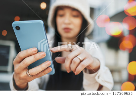 Hands, travel and woman with phone at a cafe for social media, texting or chatting in a city. Smartphone, app and lady influencer at coffee shop for content creation, podcast or traveling blog post Hands, travel and woman with phone at a cafe for social media, texting or chatting in a city. Smartphone, app and lady influencer at coffee shop for content creation, podcast or traveling blog post 137569625