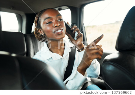 Phone call, pointing and a business black woman a taxi for transport or ride share on her work commute. Mobile, communication and direction with a young employee in cab backseat as a travel passenger 137569662