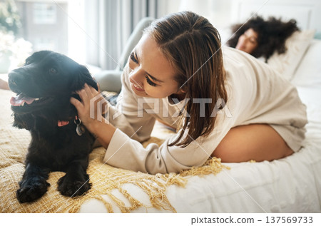 Dog, bed and happy lesbian couple play in home, morning and relax together in house. Pet, bedroom and gay women with animal, bonding and having fun in healthy relationship, love connection and care Dog, bed and happy lesbian couple play in home, morning and relax together in house. Pet, bedroom and gay women with animal, bonding and having fun in healthy relationship, love connection and care 137569733