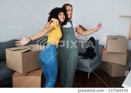 Lesbian, couple and hug for moving, home and dog in living room with excited, happiness and celebration in apartment or property. Happy, people and women together with boxes and pet in new house Lesbian, couple and hug for moving, home and dog in living room with excited, happiness and celebration in apartment or property. Happy, people and women together with boxes and pet in new house 137569749