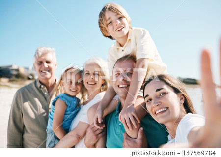 Family, grandparents and children in beach selfie, smile or bonding for love, sunshine or memory on vacation. Men, women and kids by sea, portrait or happy with social media post for summer in Spain 137569784