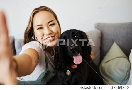 Love, selfie and woman with dog on home sofa to relax and play with animal. Pet owner, care and asian person influencer with companion, smile and friendship or social media profile picture and memory Love, selfie and woman with dog on home sofa to relax and play with animal. Pet owner, care and asian person influencer with companion, smile and friendship or social media profile picture and memory 137569800