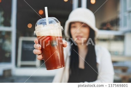 Woman hand, smoothie and closeup outdoor at a restaurant and drink from cafe. Milkshake, coffee shop and gen z fashion of a female person with a straw on break on diner patio with blurred background Woman hand, smoothie and closeup outdoor at a restaurant and drink from cafe. Milkshake, coffee shop and gen z fashion of a female person with a straw on break on diner patio with blurred background 137569801