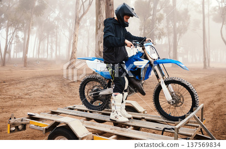 Motorbike, man and sports in forest with training for competition, riding in nature with action and helmet. Extreme, adrenaline and exercise, athlete and transport with dirt bike, freedom and travel Motorbike, man and sports in forest with training for competition, riding in nature with action and helmet. Extreme, adrenaline and exercise, athlete and transport with dirt bike, freedom and travel 137569834