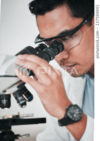 Microscope, face of man and laboratory for science research, dna analysis and studying chemical development. Asian scientist, biotechnology and check lens to review investigation, test and assessment 137569841