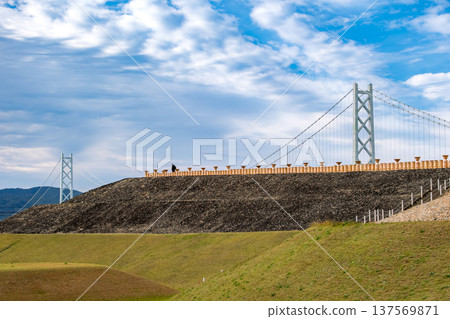Kobe, Hyogo Prefecture: Looking up at the roofing stones of the Goshikizuka Tomb and the magnificent view of the Akashi Kaikyo Bridge Kobe, Hyogo Prefecture: Looking up at the roofing stones of the Goshikizuka Tomb and the magnificent view of the Akashi Kaikyo Bridge 137569871